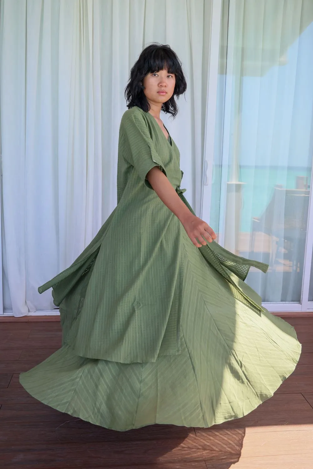 Sap green side knotted wrap slit tunic with button embellished sleeve